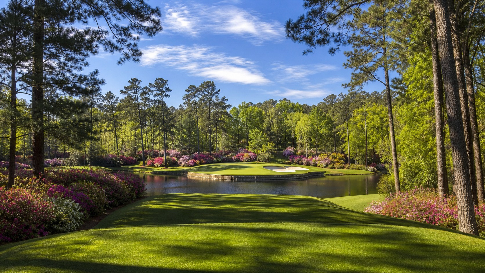 short par-three championship hole over a creek with azaleas, photographed in a wide editorial landscape